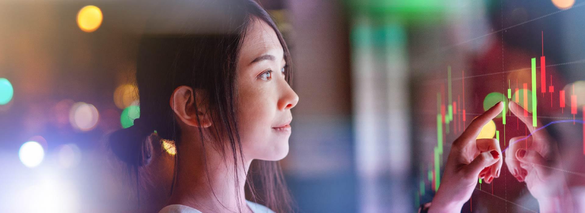 Woman touching digital sign