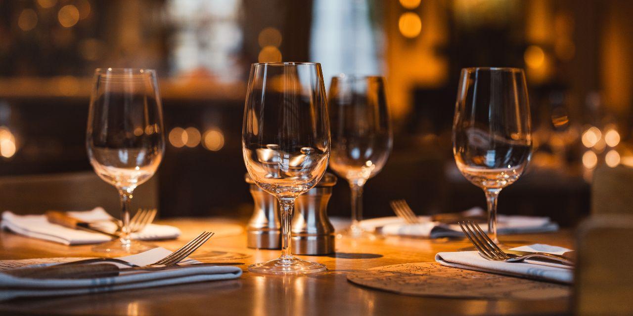 Glasses and silverware on a wooden table