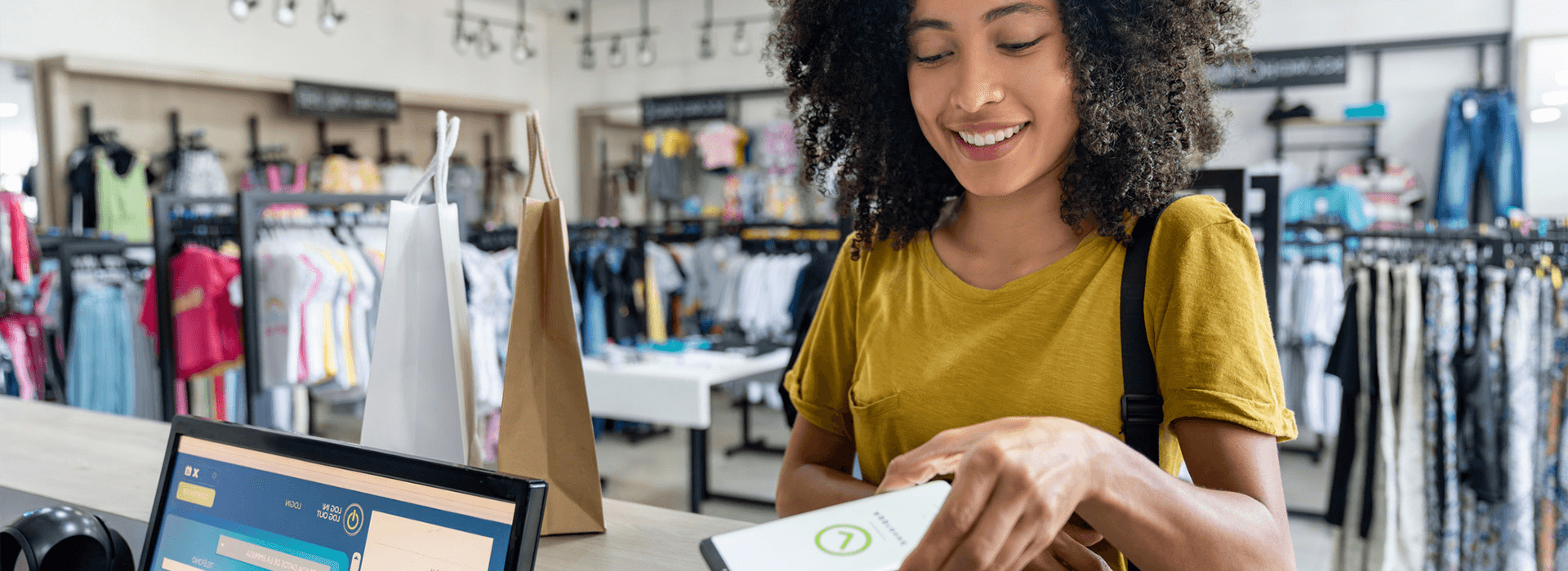 A woman paying in store on mobile