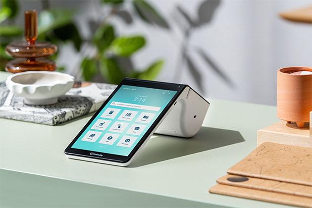 Image of our Poynt device for Commerce360 on a retail shop counter