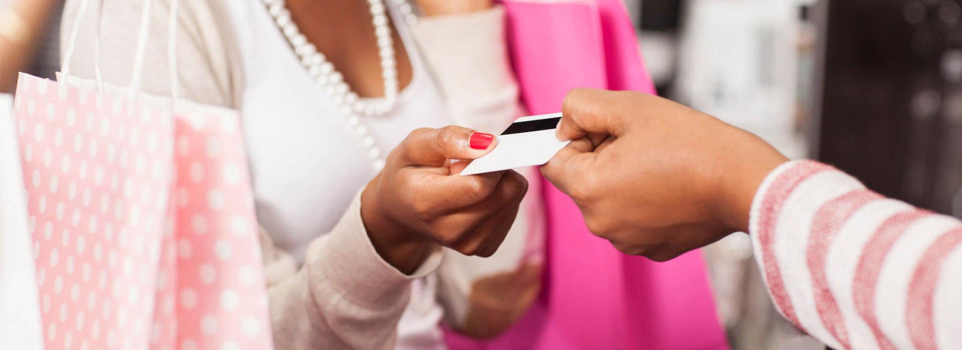 lady handing someone a prepaid card